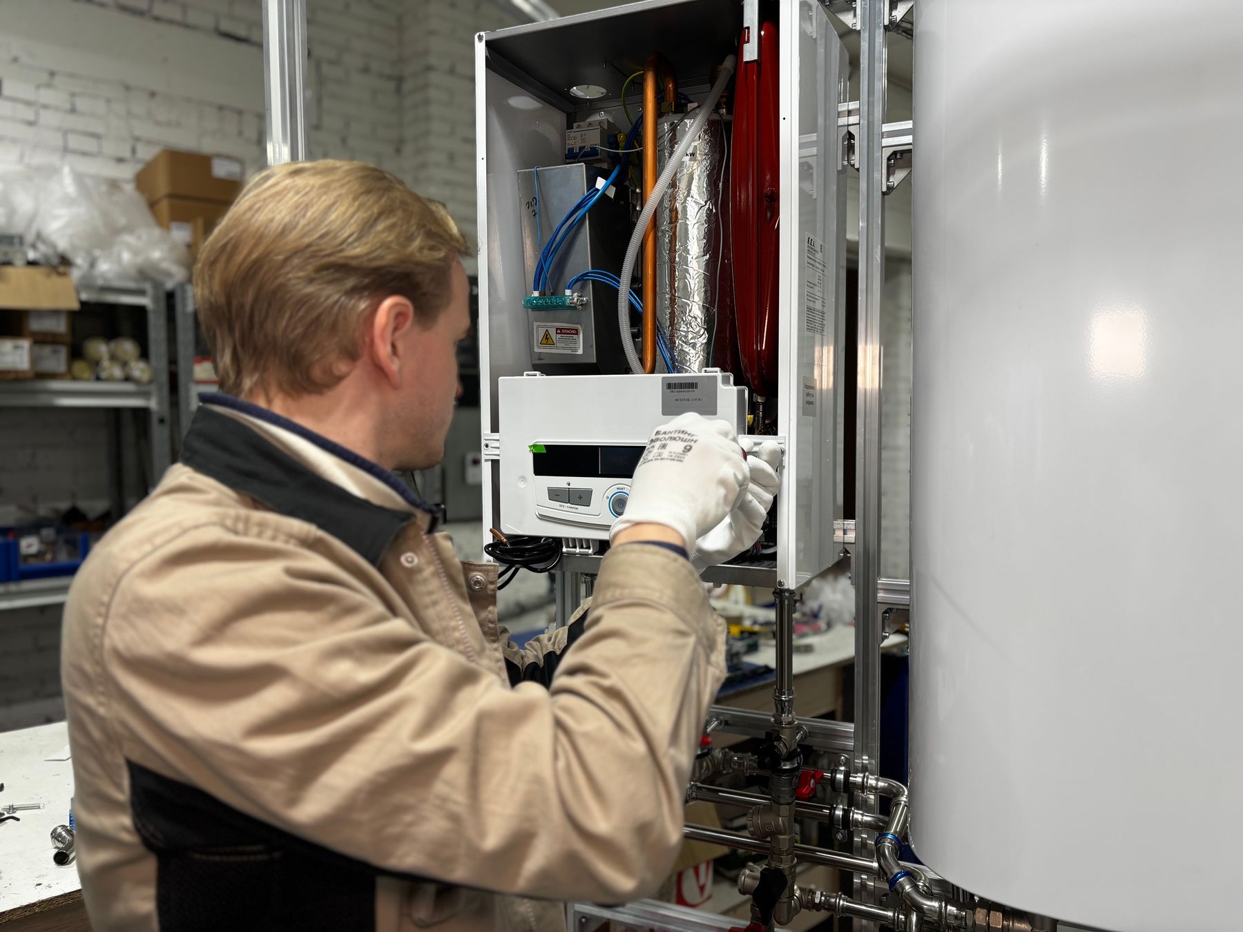 Technician servicing heating equipment from the Northforge website